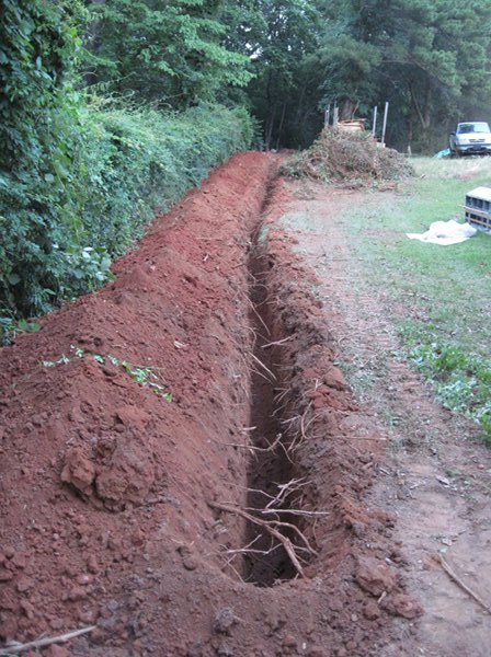 Digging long trench for utlities for irrigation system
