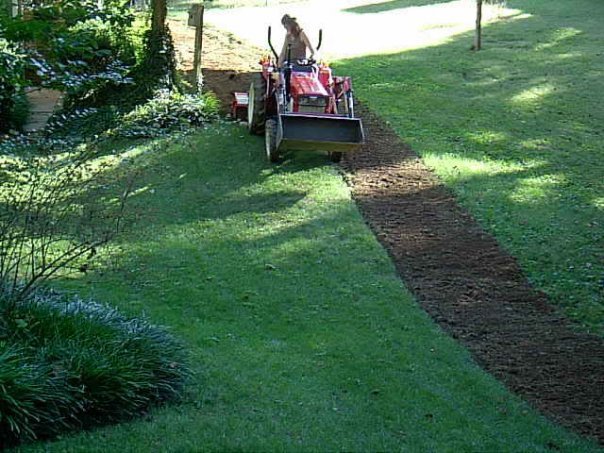 Roto tilling a backyard