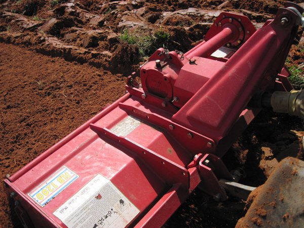 Rototilling the plowed sod